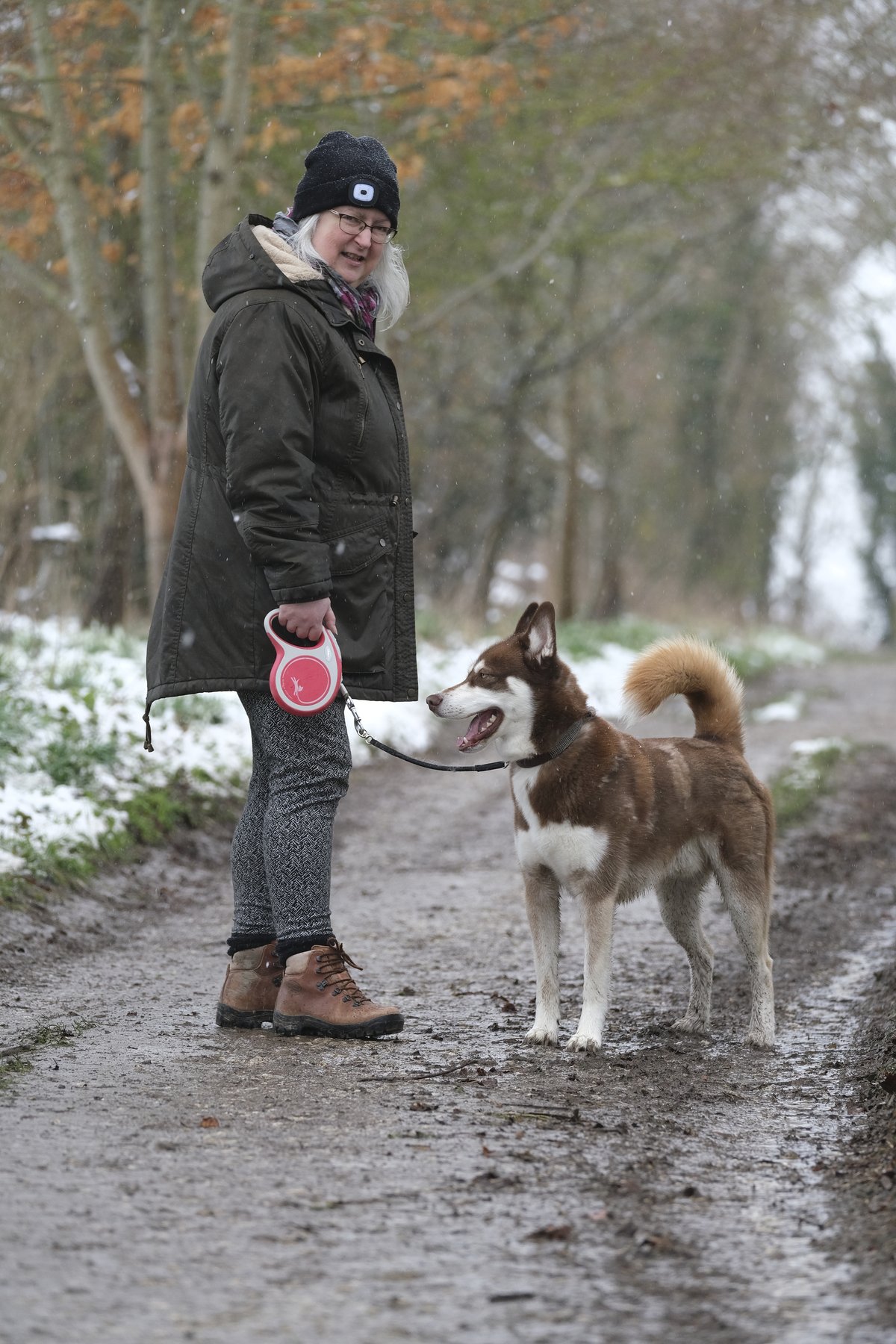 Elaine walking Koda in the snow